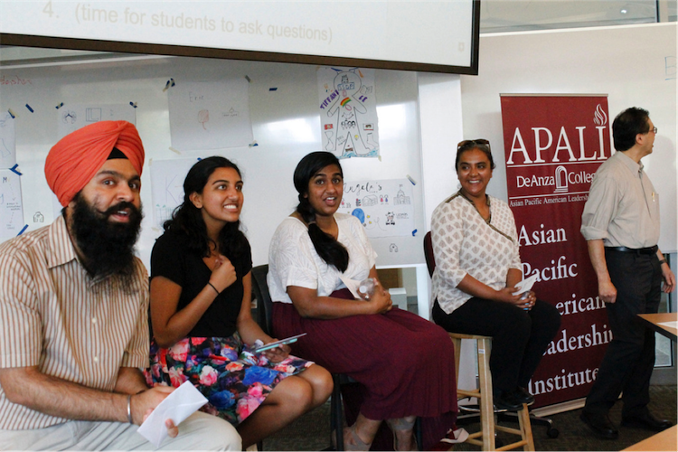 people seated with APALI sign