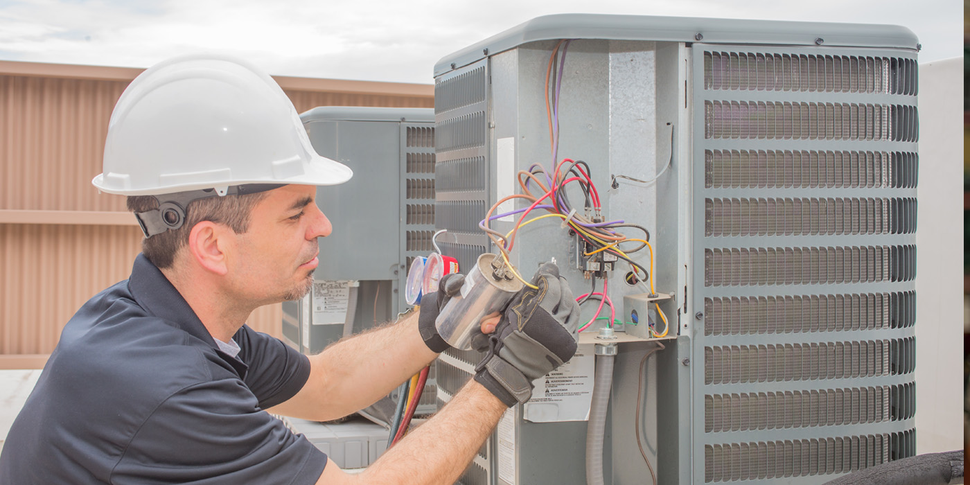 man fixing HVAC