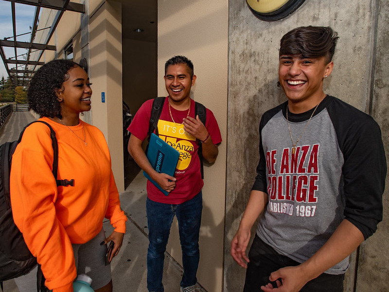 three students laughing