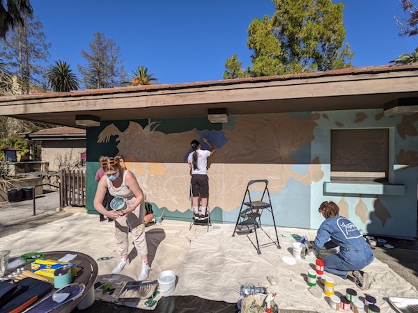 students working on mural