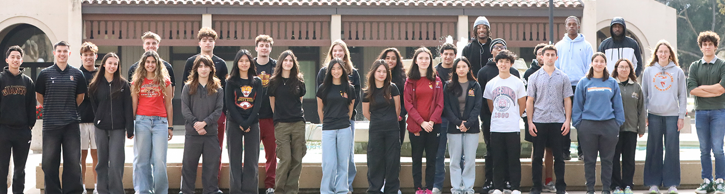 student athletes in group in front of Campus Center