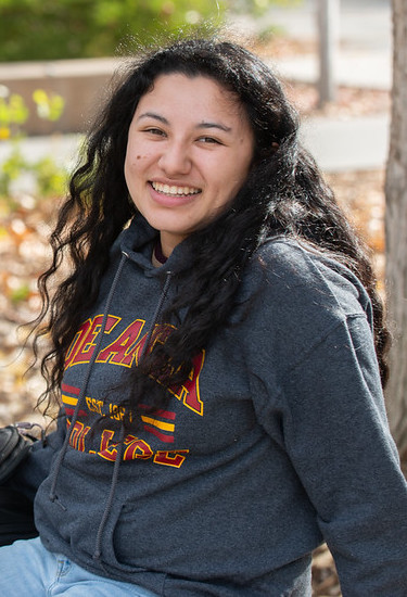 smiling young woman in De Anza sweatshirt